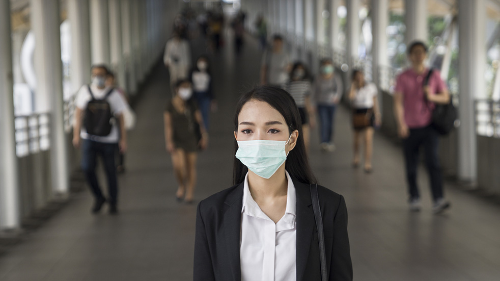 Everything you need to know about coronavirus; woman with a face mask